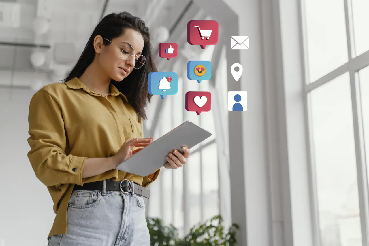 Social media marketer reviewing engagement icons on a tablet