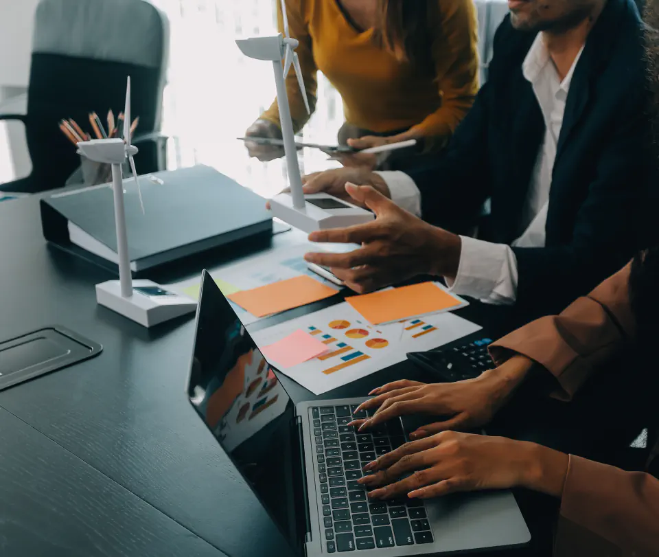 Marketing team reviewing growth reports and campaign notes