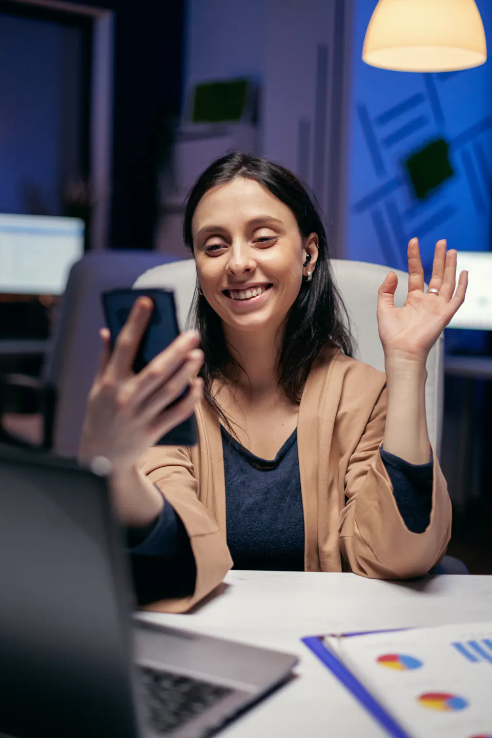 Consultant greeting a client during a video call